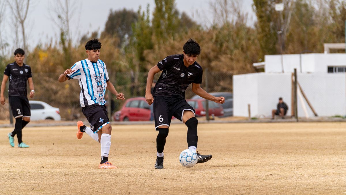 Young players in a local football match, showcasing skill and teamwork. Young players in a local football match, showcasing skill and teamwork.