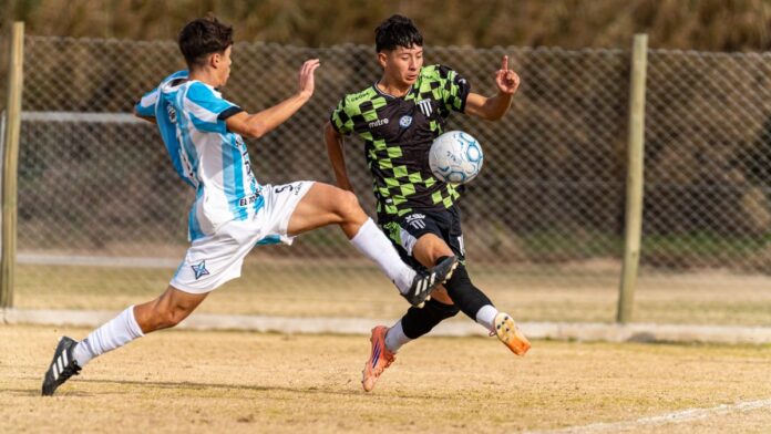 Two soccer players in action during a competitive outdoor match.