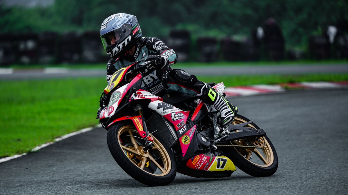 Professional motorcycle racer on a track in Tarlac City, showing dynamic speed and agility.
