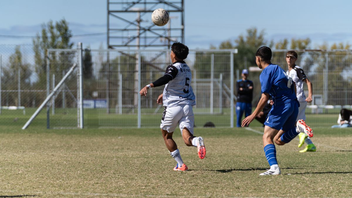 Dynamic soccer game featuring two players vying for the ball on the field.