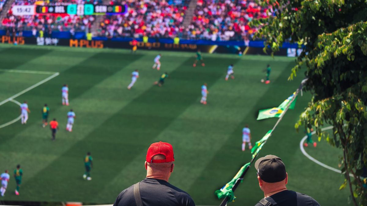 Engaging view of soccer fans enjoying a live match at a stadium in Langford, BC, Canada.