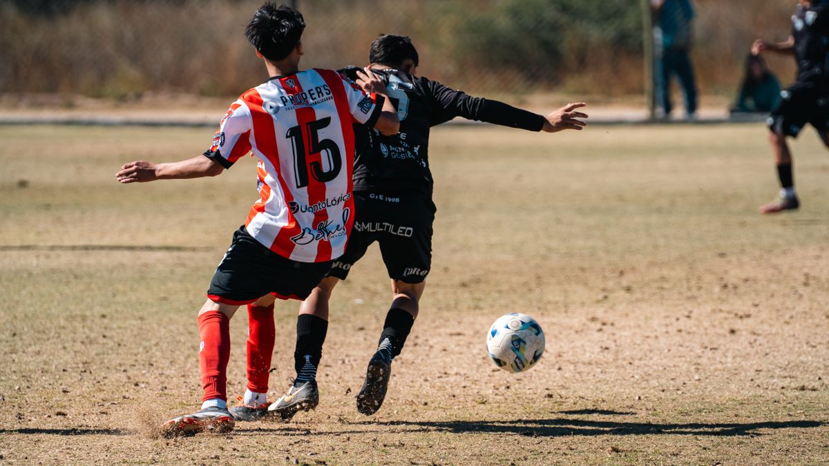 Action-packed soccer game with players competing aggressively outdoors.