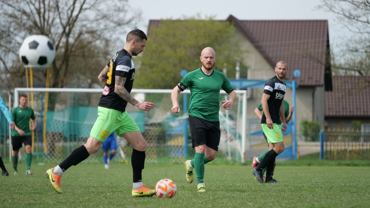 Intense soccer match with players in motion on a vibrant green field. Perfect sports action shot.