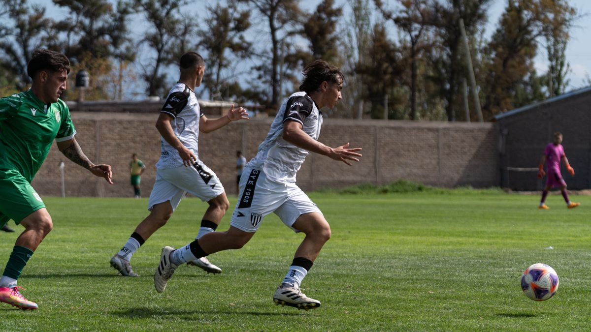 Action-packed soccer match with players in motion on the field. Action-packed soccer match with players in motion on the field.
