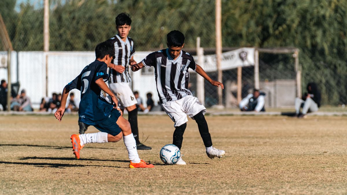 Boys playing soccer outdoors on a sunny day, showcasing youthful energy and teamwork. Boys playing soccer outdoors on a sunny day, showcasing youthful energy and teamwork.