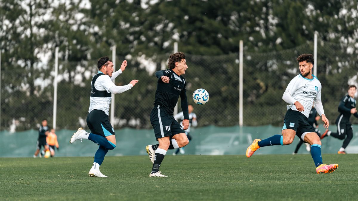 Dynamic action shot of a competitive soccer match outdoors.