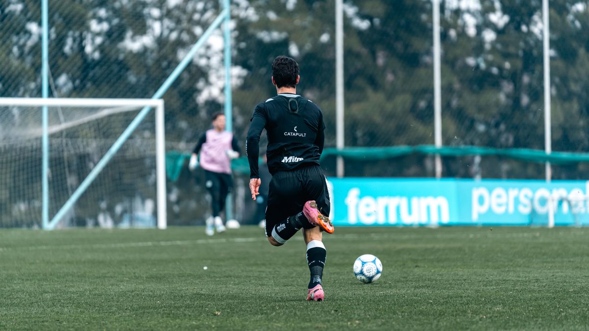 Soccer player practicing during a training session on a beautiful outdoor field. Soccer player practicing during a training session on a beautiful outdoor field.