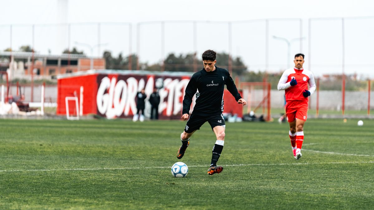 Action shot of soccer players practicing on an outdoor field, highlighting movement and sportsmanship. Action shot of soccer players practicing on an outdoor field, highlighting movement and sportsmanship.
