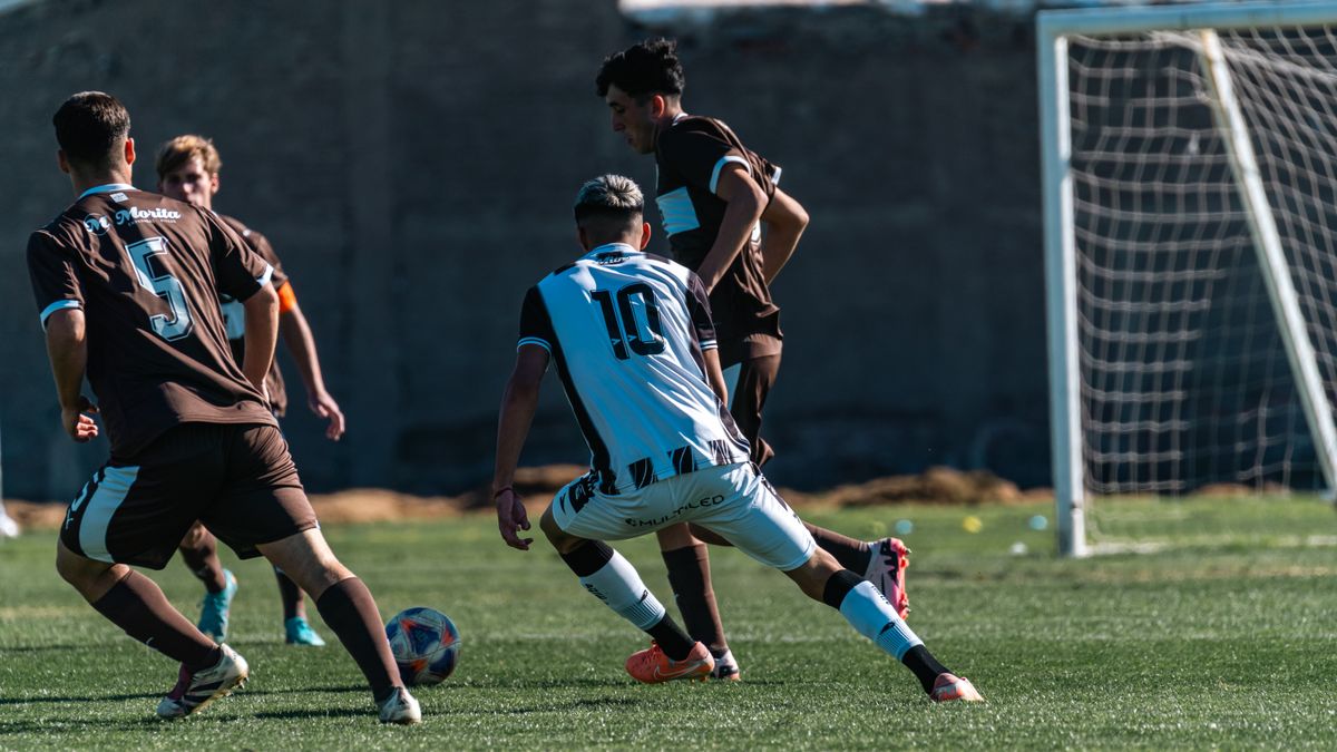 Action-packed soccer game with players competing on a grassy field.