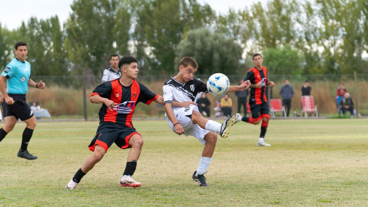 Dynamic action shot of a youth soccer match capturing intense competition.