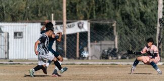 Dynamic soccer match featuring focused players in action, emphasizing sportsmanship and teamwork on an outdoor field.
