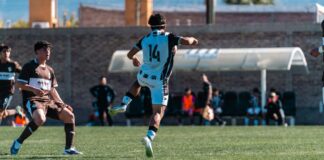 Dynamic soccer match with young players on a sunny field