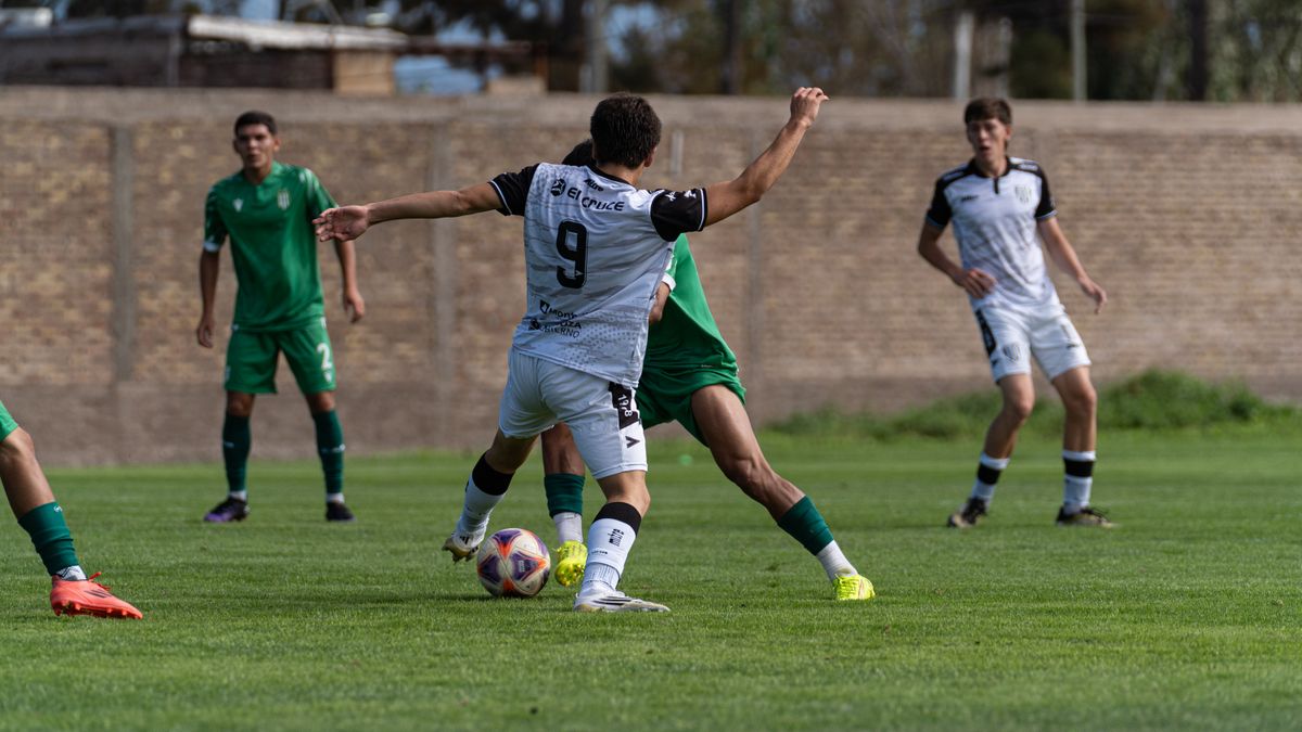 Players in action during an exciting outdoor soccer match on a grassy field. Players in action during an exciting outdoor soccer match on a grassy field.
