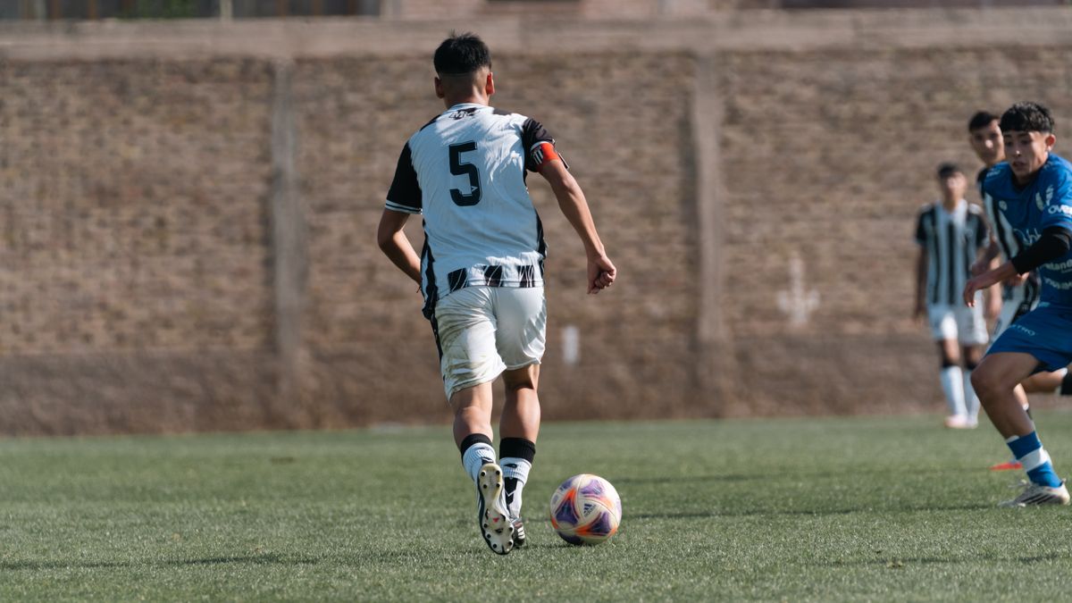 Soccer players engaged in an intense match, showcasing skill and teamwork. Soccer players engaged in an intense match, showcasing skill and teamwork.