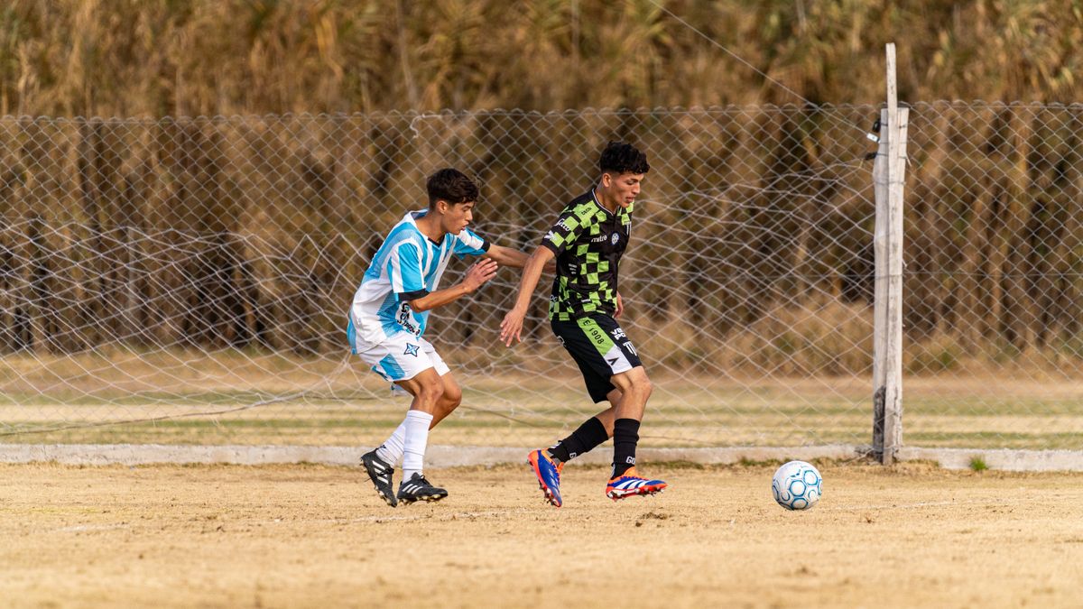 Action-packed soccer game between two teenage players on outdoor field. Action-packed soccer game between two teenage players on outdoor field.