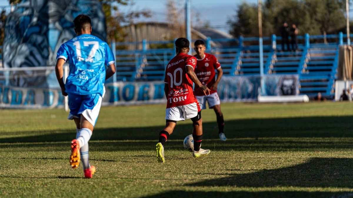 Soccer players competing during a thrilling outdoor match on a sunny day. Soccer players competing during a thrilling outdoor match on a sunny day.