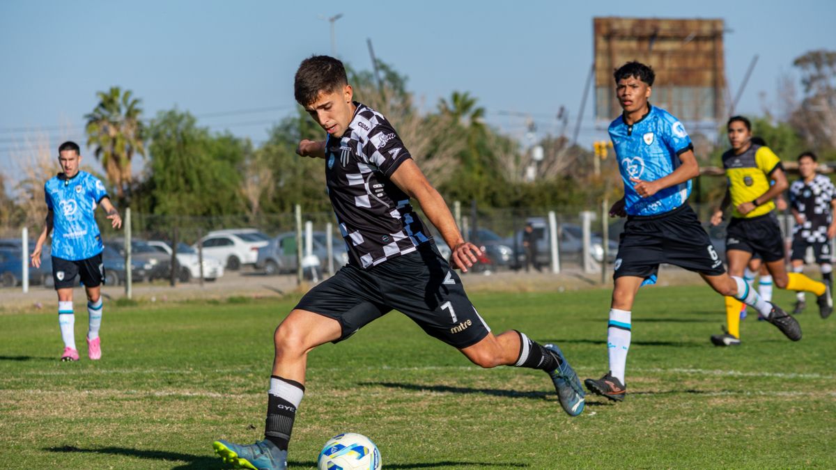 Energetic soccer match with young athletes in action on a bright and sunny day outdoors. Energetic soccer match with young athletes in action on a bright and sunny day outdoors.