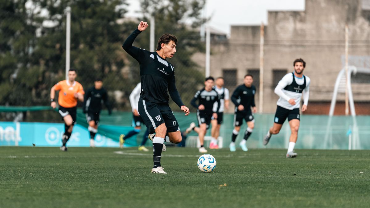 Professional soccer players in action during a training session on a field. Professional soccer players in action during a training session on a field.