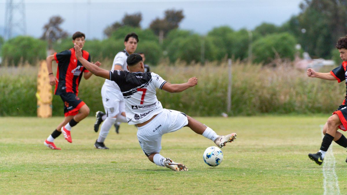 Exciting action moment during a youth soccer match, players competing outdoors. Exciting action moment during a youth soccer match, players competing outdoors.
