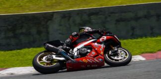 High-speed motorcycle race action shot on a circuit in Batangas, Philippines.