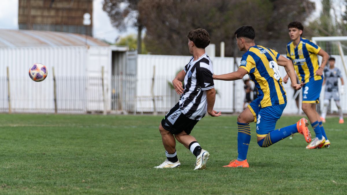 Dynamic action shot of male soccer players competing in a football match. Dynamic action shot of male soccer players competing in a football match.