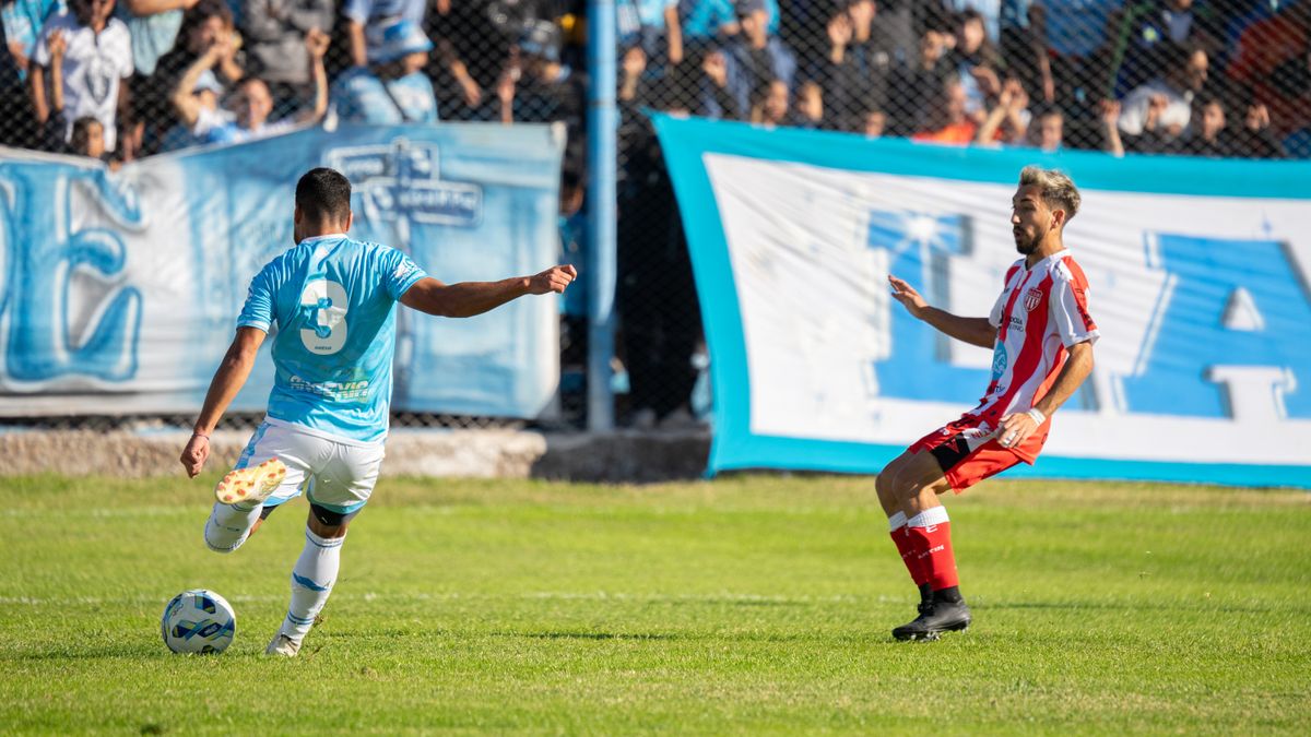 Action-packed soccer match with players in blue and red uniforms competing fiercely on the field. Action-packed soccer match with players in blue and red uniforms competing fiercely on the field.