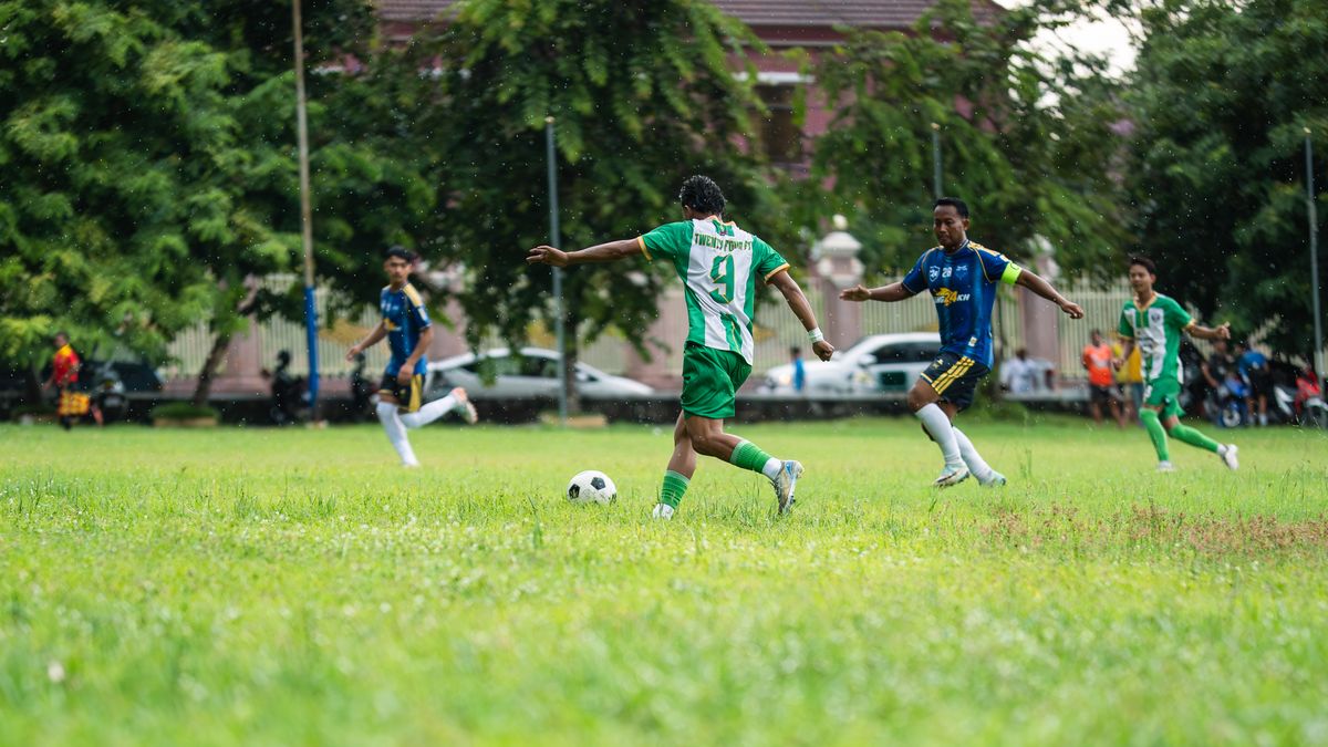 Dynamic soccer game played on a grassy field with enthusiastic players in action. Dynamic soccer game played on a grassy field with enthusiastic players in action.