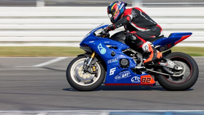 Dynamic shot of a motorcycle racer speeding on Hockenheim circuit in Germany.