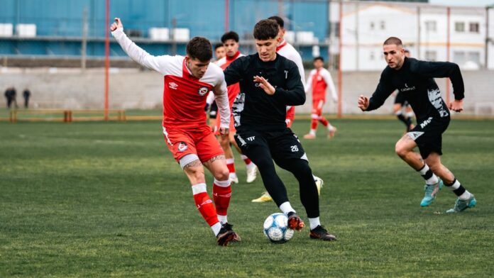 Dynamic soccer match capture with competing players striving for the ball outdoors. Dynamic soccer match capture with competing players striving for the ball outdoors.