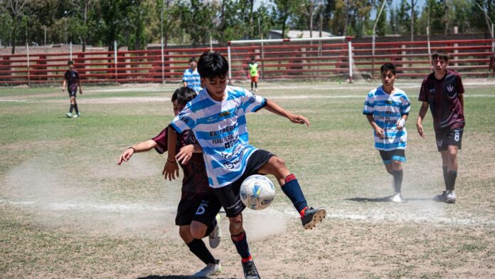 Intense moment in a youth soccer match on a sunny day with players in action. Intense moment in a youth soccer match on a sunny day with players in action.