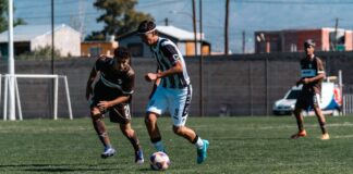 A thrilling moment in a soccer match as players vie for control of the ball.
