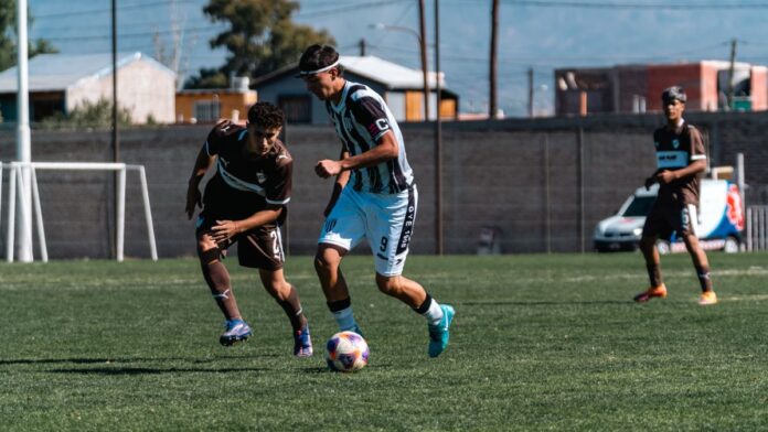 A thrilling moment in a soccer match as players vie for control of the ball. A thrilling moment in a soccer match as players vie for control of the ball.
